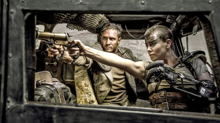 (L-r) TOM HARDY as Max Rockatansky and CHARLIZE THERON as Imperator Furiosa in Warner Bros. Pictures' and Village Roadshow Pictures' action adventure "MAD MAX: FURY ROAD," a Warner Bros. Pictures release. from Warner Bros. media site